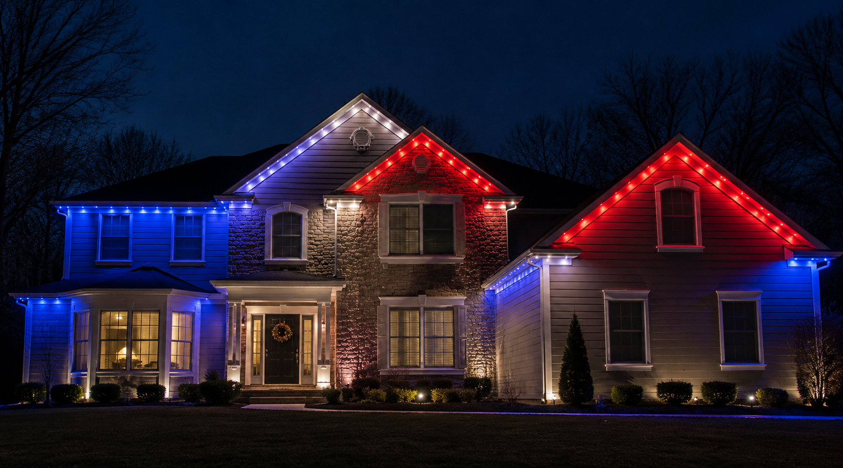 Home with permanent LED lighting displayed in red, white, and blue at night